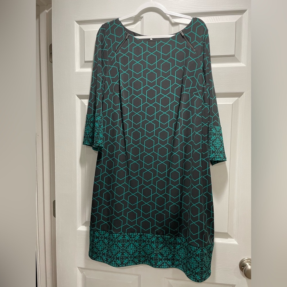 Navy and teal dress with a geometric pattern and 3/4 length sleeves